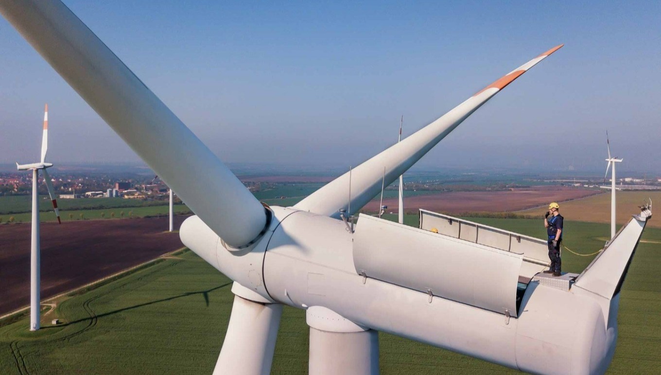 Man repairing wind turbine