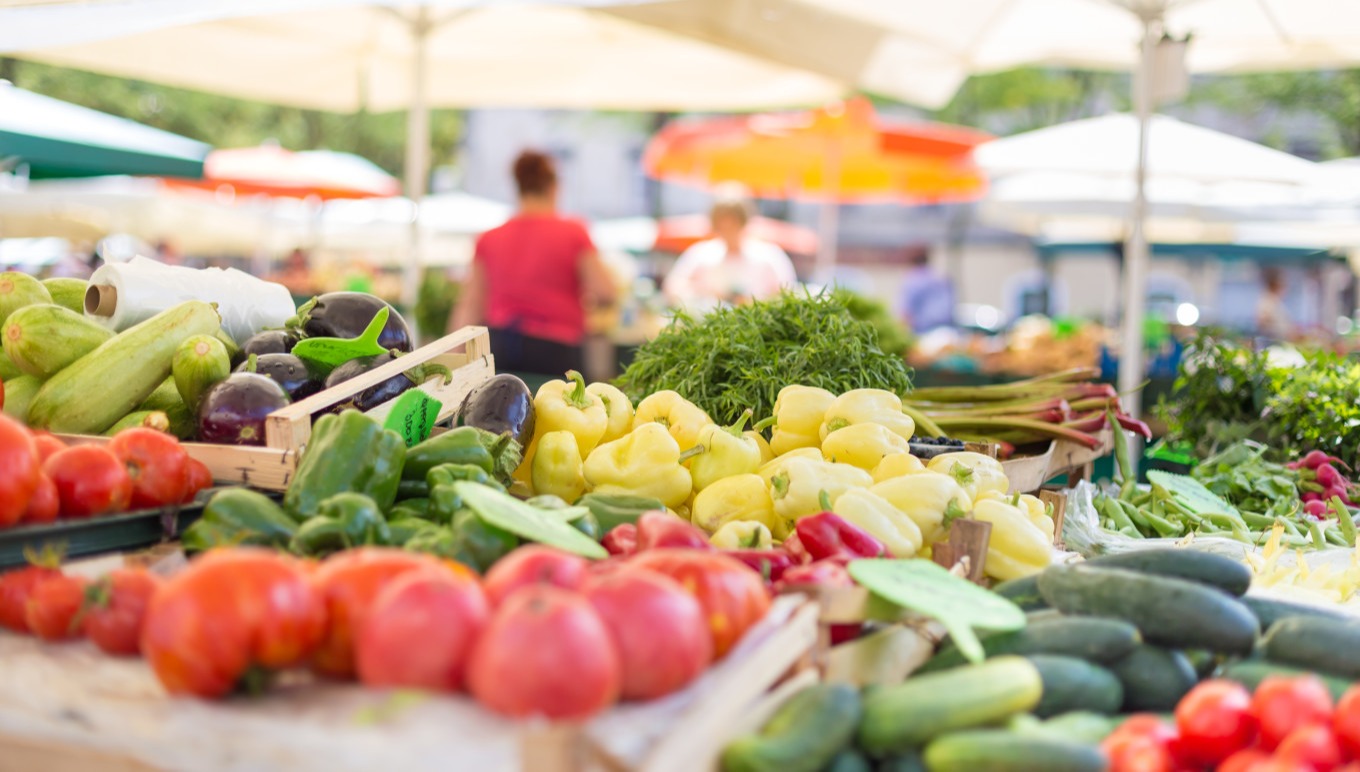 Fresh fruits and vegetables at an outdoor market.