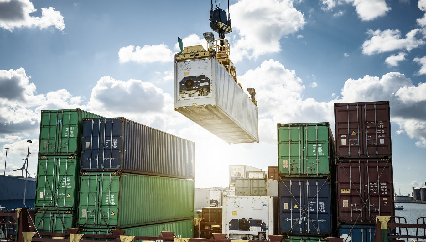 Cargo containers being moved by crane