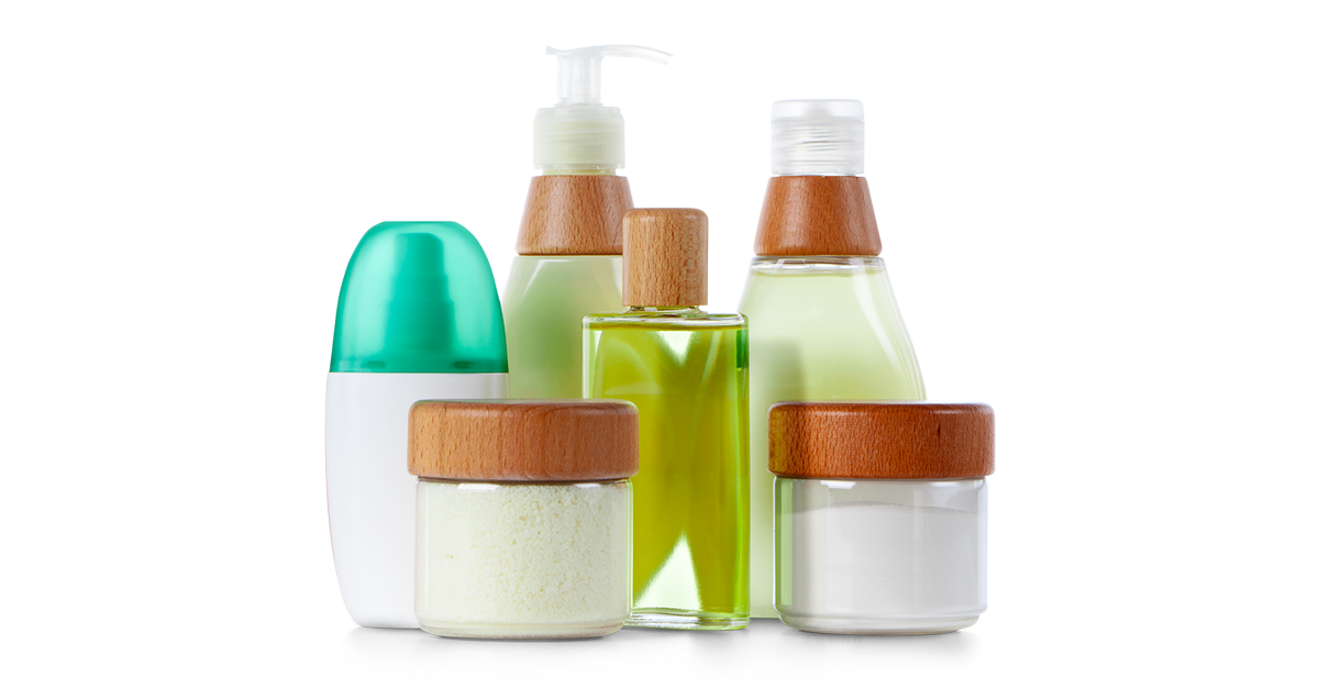 Assorted glass bottles containing body lotion.