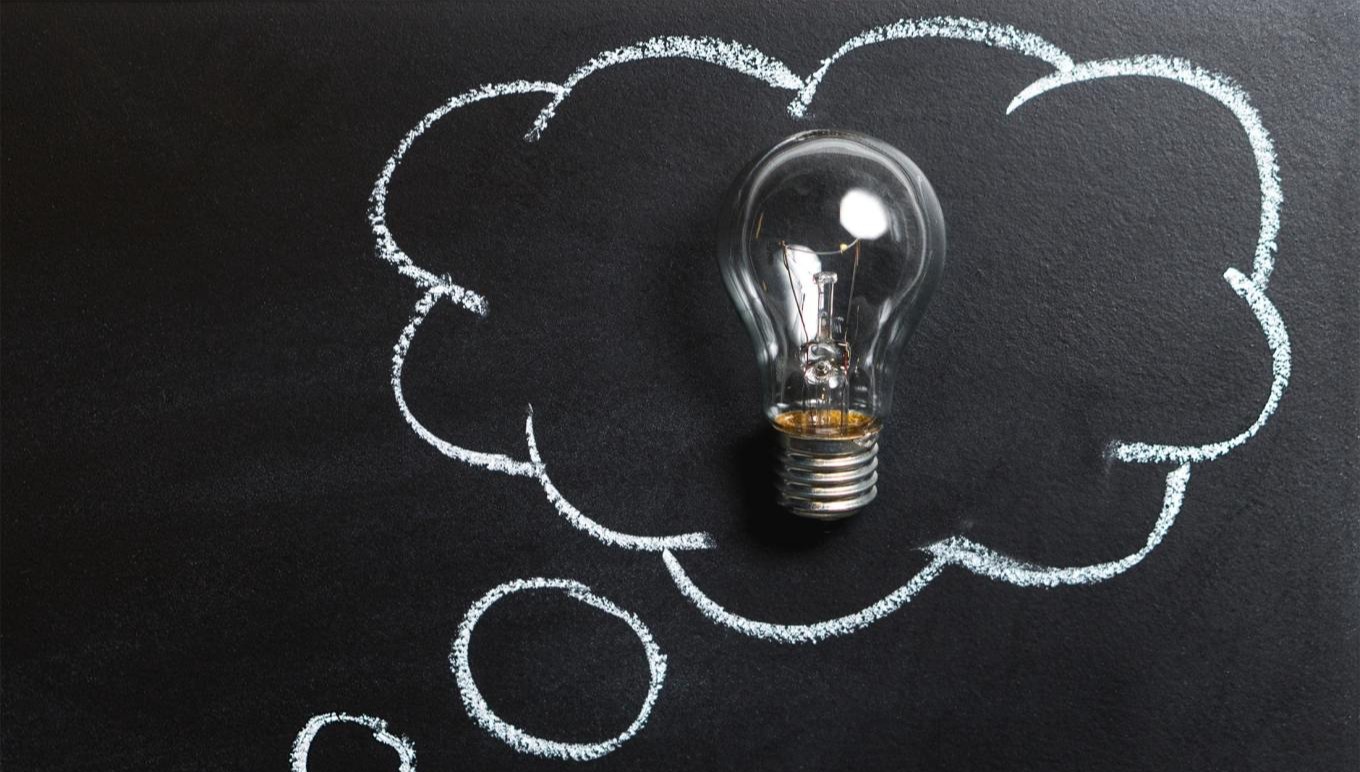 A lightbulb in a thought bubble representing a new idea.