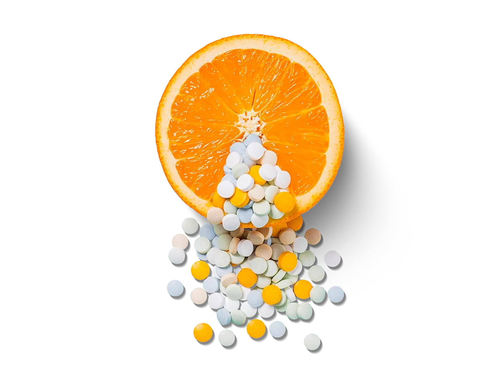 Vitamine C pillen en een citrusvrucht