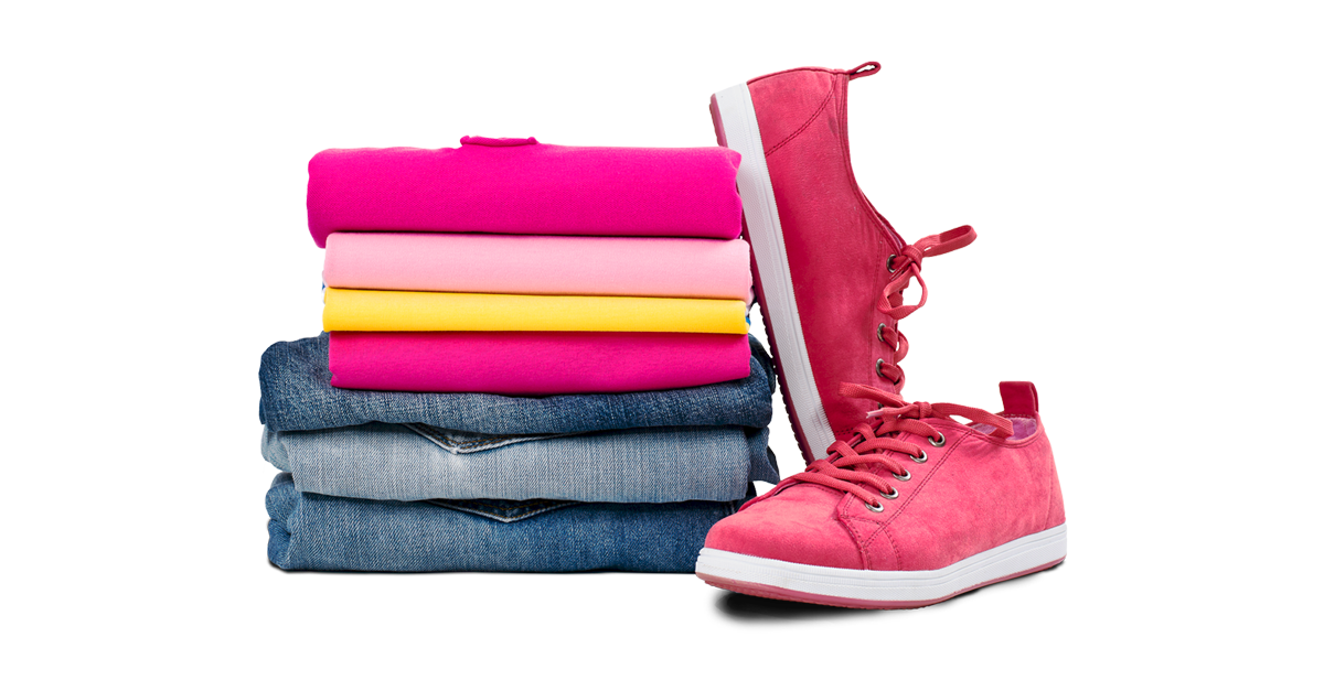 A pile of folded clothes and a pair of pink sneakers.