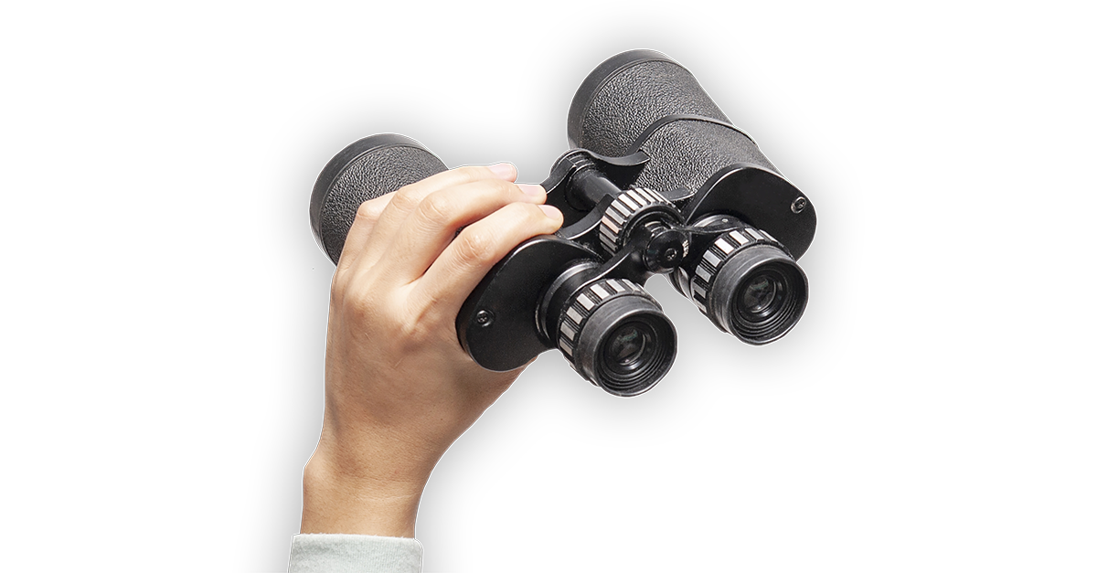 Person holding binoculars