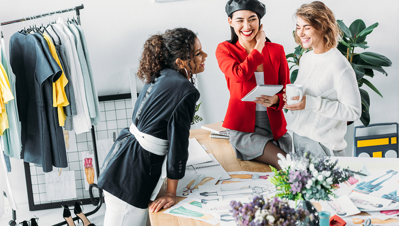3 Women smiling having a conversation