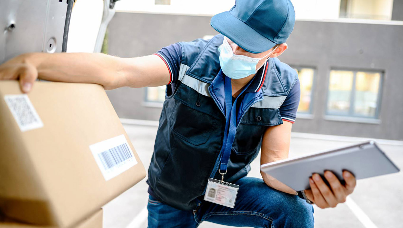 Delivery driver inspecting box