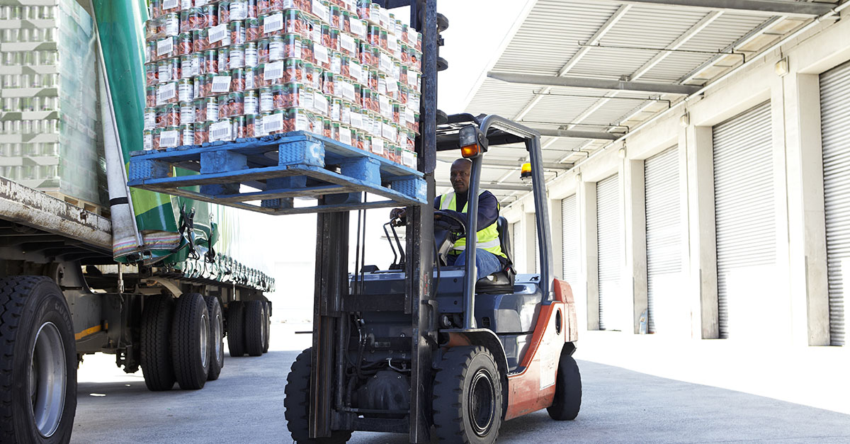 Loading product unto delivery truck from warehouse