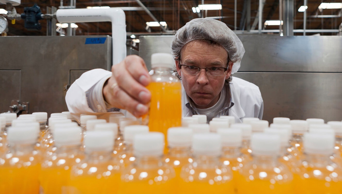 Worker examining bottling