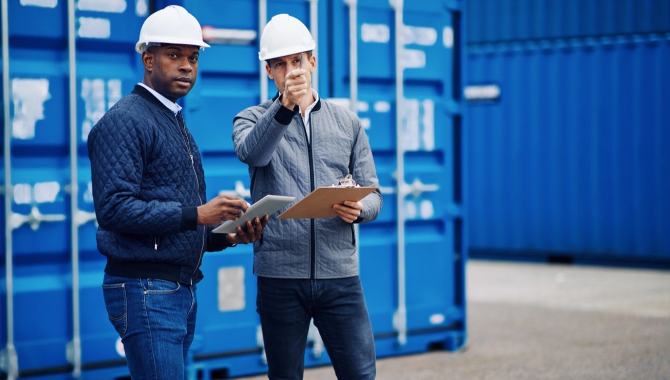 Men in hardhats in warehouse