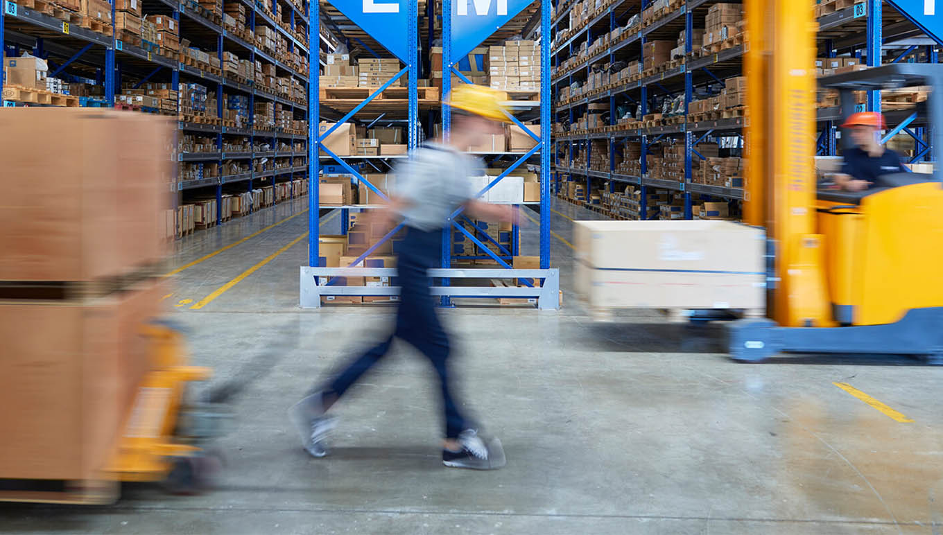 blurred worker in warehouse